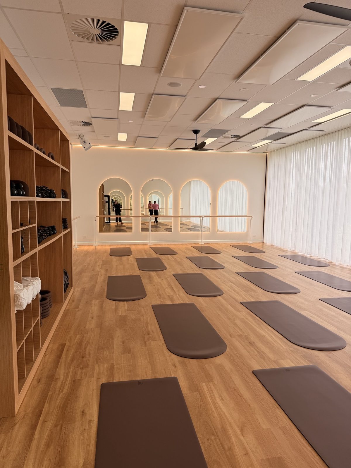 Fernwood Pakenham's barre and mat studio with arched mirrors and timber floors