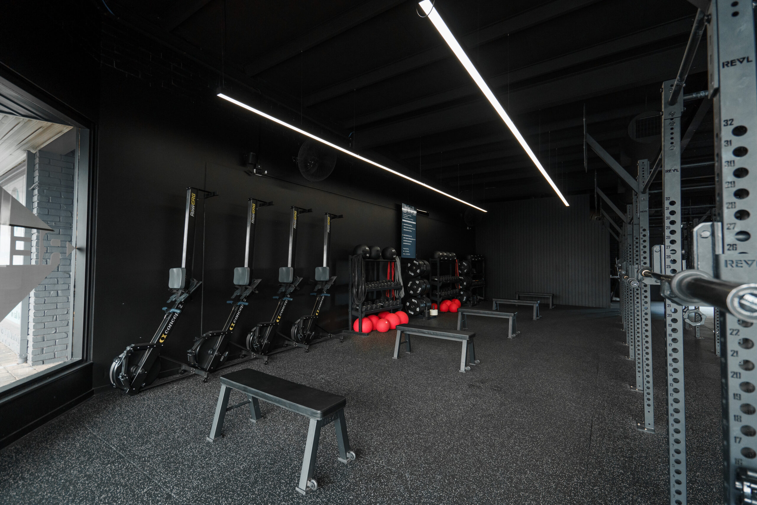 REVL studio fitted out by MasterKraft — Concept2 RowErgs, benches, dumbbells and a rig